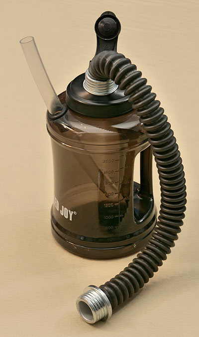 Bubble bottle made to wear on the back with a harness