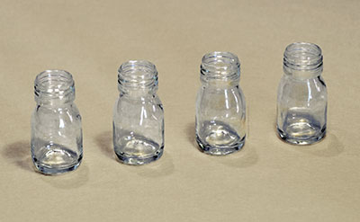 Four glass bottles